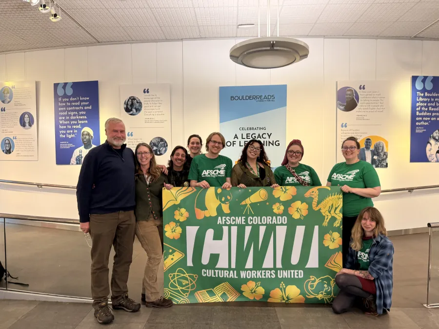 Workers from BPLD in the library holding a Cultural Workers Union banner